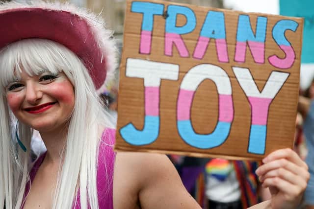 A trans joy sign is held up as members of Scotland's LGBTQ+ community attend June's annual Pride March in Edinburgh (Picture: Jeff J Mitchell/Getty Images)