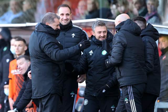 Celtic manager Ange Postecoglou (left) celebrates with his coaches John Kennedy and Gavin Strachan, and goalkeeping specialist Stevie Woods, who he was happy to inherit as he arrived alone in Scotland, despite supporter opposition to his retaining Kennedy and  Strachan. (Photo by Craig Williamson / SNS Group)
