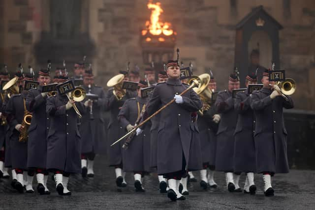 Pipers and musicians from The Royal Scots Dragoon Guards play during the Beating Retreat ceremony on the Esplanade of Edinburgh Castle to mark the transfer of the Stone of Destiny, which is moving to Perth Museum later this month. Picture: Jeff J Mitchell/Getty Images