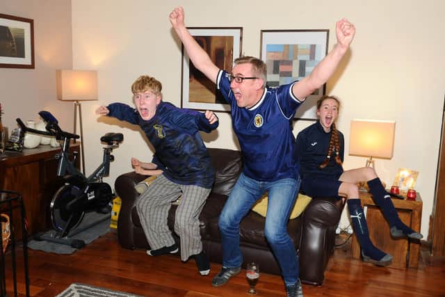 The Robertson family from Avonbridge watched from home as Scotland won 5-4 on penalties against Serbi in a match made free to air by Sky in November 2020. (Picture: Michael Gillen)