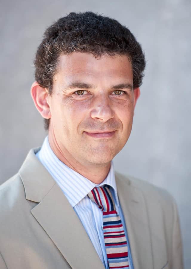 Professor Eric Miller said the survivors of the massacre and descendants of its victims deserve "transformational justice." Picture: Loyola Marymount University
