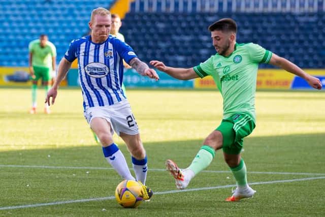 Celtic's Greg Taylor holds off Kilmarnock's Chris Burke during a Scottish Premiership match between Kilmarnock and Celtic at Rugby Park, on August 09, 2020, in Kilmarnock, Scotland. 
(Craig Williamson / SNS Group)