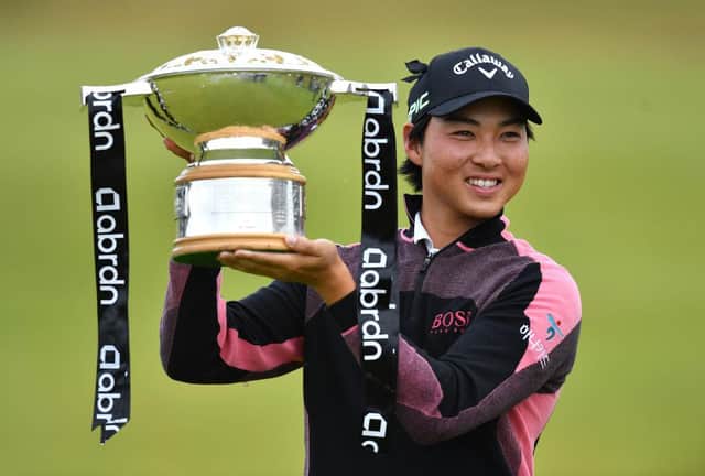 Min Woo Lee celebrates with the trophy after winning the abrdn Scottish Open at The Renaissance Club last month. Picture: Mark Runnacles/Getty Images.