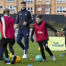 Scotland International Lyndon Dykes probably telling youngsters goalkeeping tale tales during McDonald's Fun Football event at  Lesser Hampden this week. (Photo by Ross MacDonald / SNS Group)