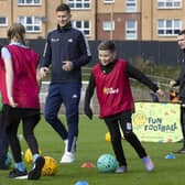 Scotland International Lyndon Dykes probably telling youngsters goalkeeping tale tales during McDonald's Fun Football event at  Lesser Hampden this week. (Photo by Ross MacDonald / SNS Group)