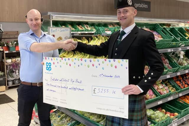 Daryl Black, Store manager at Ballater Co-op with James Cooper, Pipe Major Ballater and District Pipe Band