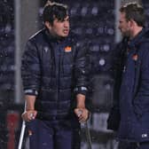 Edinburgh hooker Stuart McInally in crutches at the end of the game as he speaks to coach Mike Blair.  (Photo by Craig Williamson / SNS Group)