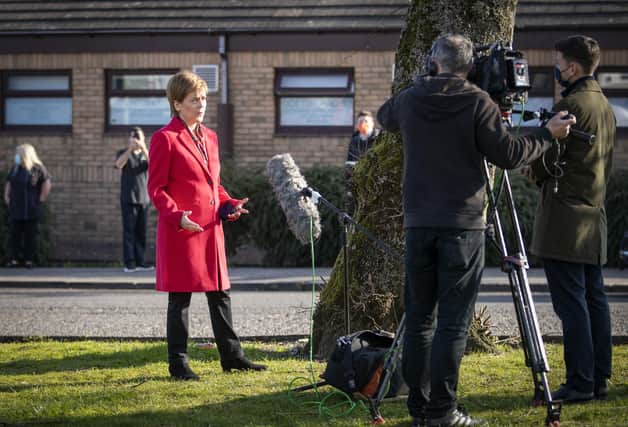 Scotland's First Minister Nicola Sturgeon speaks to the media during a visit to the Thornliebank Dental Care centre in Glasgow during the election campaign.