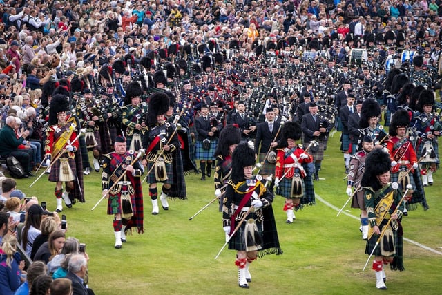 The Massed Pipes and Drums parade in the arena during the Braemar Royal Highland Gathering