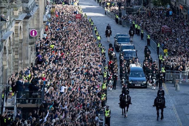 Crowd line the Royal Mile for the procession of the late Queen's coffin from the Palace of Holyroodhouse to St Giles Cathedral earlier this week