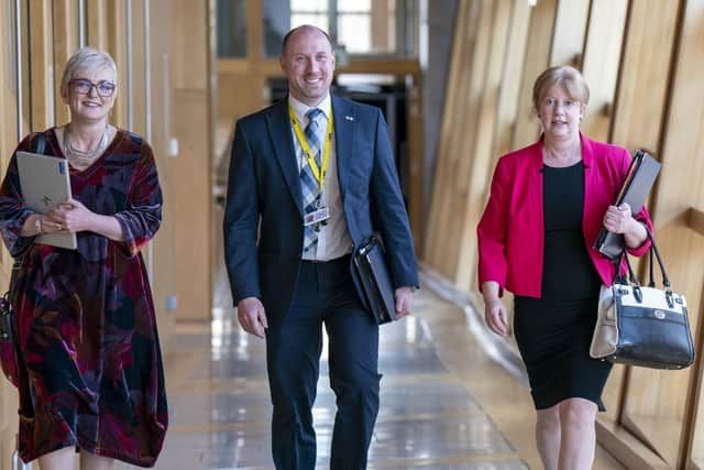 Neil Gray (centre) spoke to reporters at a visit to Allied Vehicles in Glasgow.