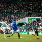 Kyogo Furuhashi curls home Celtic's second goal against Rangers.