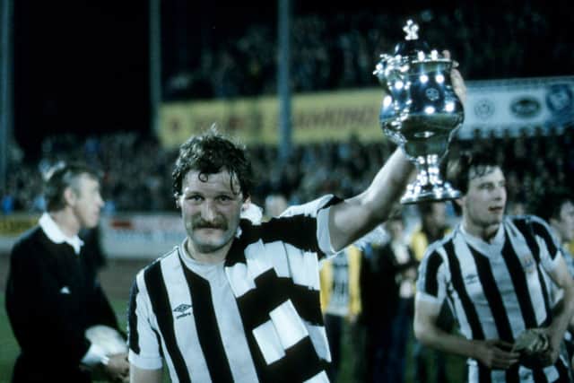 St Mirren captain Bone celebrates with the Anglo-Scottish Cup in 1980.