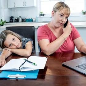 Many parents are juggling working from home and home schooling.