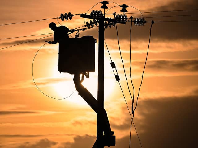 Engineers from Scottish and Southern Electricity Networks repair power lines in Edzell, Scotland. The area was hit by two storms - Malik and Corrie - in quick succession over the weekend, leaving tens of thousands without power. Picture: Jeff J Mitchell/Getty Images