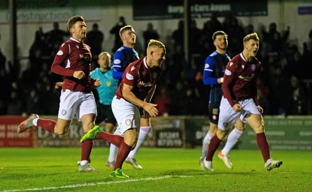 Arbroath's Nicky Low scores his penalty to make it 1-1 against Hamilton. (Photo by Bruce White / SNS Group)
