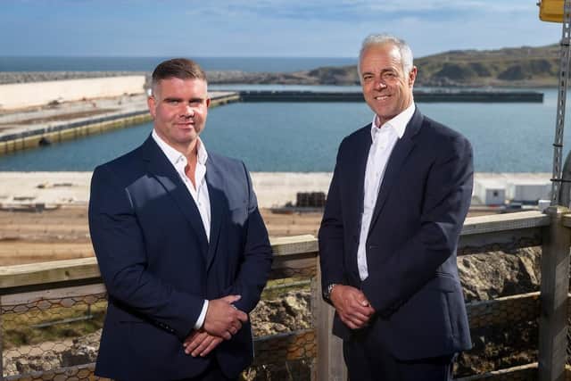Lee Hanlon and Bob Sanguinetti at the South Harbour visitor centre overlooking the new development. Picture: Newsline Media