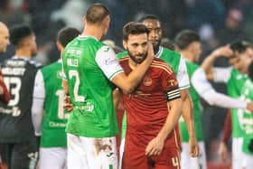 Hibs' Lewis Miller and Aberdeen's Graeme Shinnie at full time after a 2-2 draw between the two at Pittodrie.