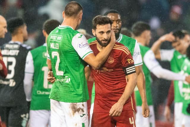 Hibs' Lewis Miller and Aberdeen's Graeme Shinnie at full time after a 2-2 draw between the two at Pittodrie.