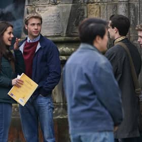Actress Meg Bellamy, who plays Kate Middleton, and actor Ed McVey, who plays the part of Prince William, film scenes for the next season of The Crown in St Andrews in