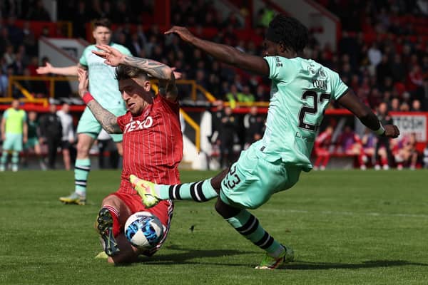 Elie Youan has his shot blocked by Angus MacDonald in Hibs' 0-0 draw with Aberdeen at Pittodrie.