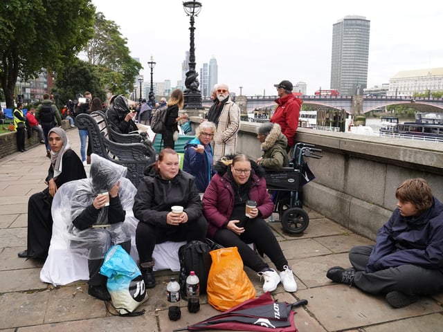 Members of the public join the queue on the South Bank, as they wait to view the coffin of Queen Elizabeth II lying in state ahead of her funeral on Monday. Picture date: Wednesday September 14, 2022.