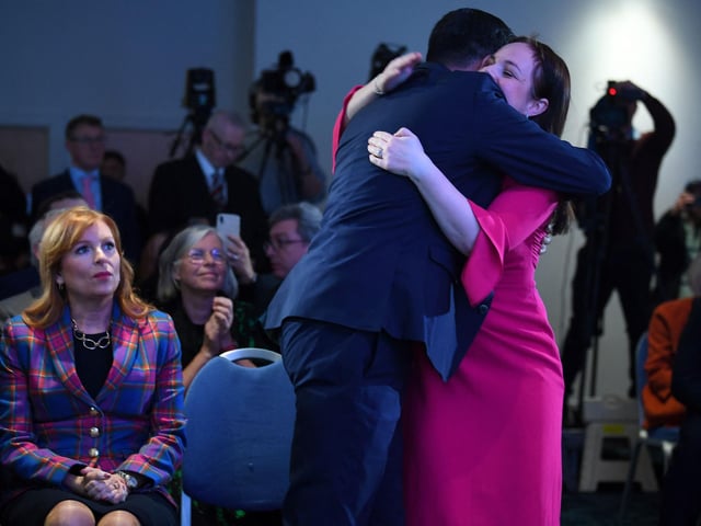 Ash Regan reacts as Kate Forbes embraces Humza Yousaf after he was named as the party's new leader