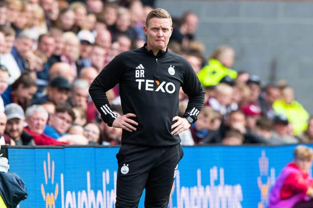 A vexed Barry Robson looks on from the sidelines as Hearts overpowered his Aberdeen team at Tynecastle.