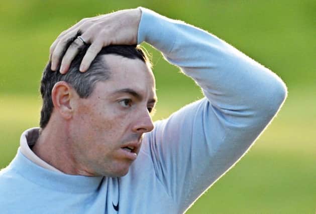 Rory McIlroy reacts after holing a ten-foot par putt on the 18th green at Royal Liverpool in the first round of the 151st Open. Picture: Glyn Kirk/AFP via Getty Images.