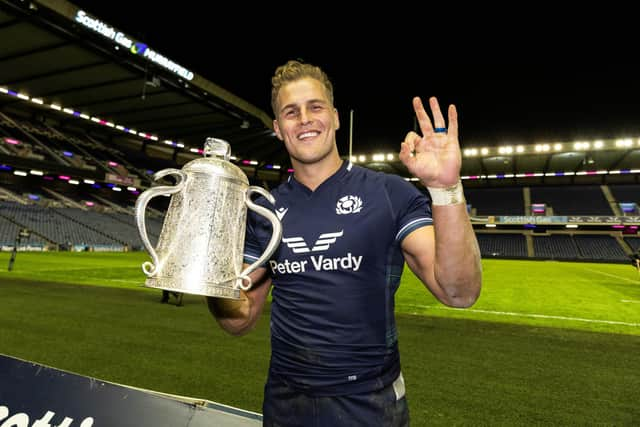 Scotland's Duhan van der Merwe celebrates at full-time with the Calcutta Cup after his hat-trick in the 31-20 win over England at Scottish Gas Murrayfield. (Photo by Craig Williamson / SNS Group)