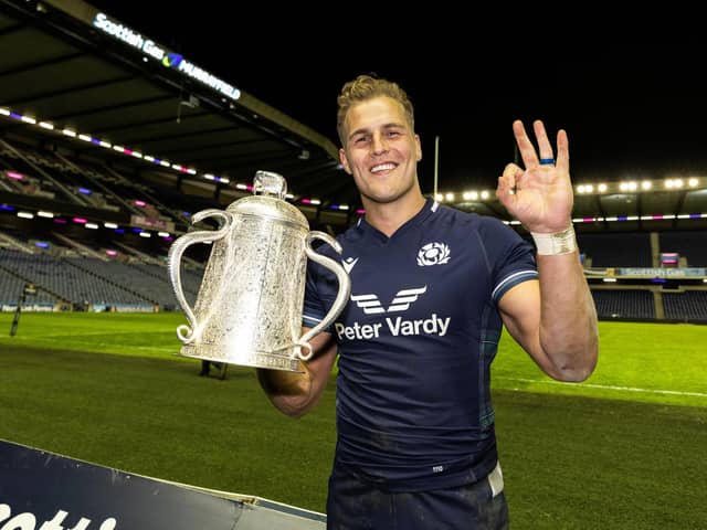 Scotland's Duhan van der Merwe celebrates at full-time with the Calcutta Cup after his hat-trick in the 31-20 win over England at Scottish Gas Murrayfield. (Photo by Craig Williamson / SNS Group)