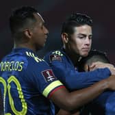 Rangers striker Alfredo Morelos (left) and James Rodriguez celebrate with Radamel Falcao after Colombia's late equaliser against Chile. (Photo by Claudio Reyes - Pool/Getty Images)