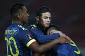 Rangers striker Alfredo Morelos (left) and James Rodriguez celebrate with Radamel Falcao after Colombia's late equaliser against Chile. (Photo by Claudio Reyes - Pool/Getty Images)