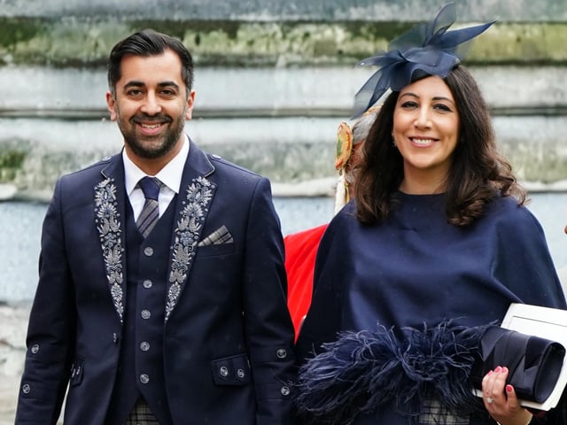 First Minister of Scotland Humza Yousaf and wife Nadia El-Nakla leave Westminster Abbey following the coronation ceremony of King Charles III and Queen Camilla in central London.