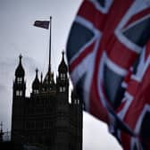 Union Jack flags hang in parliament square to mark Britain's exit from the EU (Photo by Jeff J Mitchell/Getty Images)