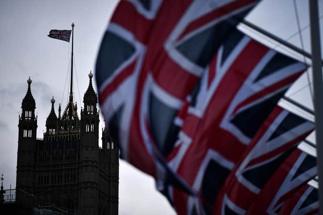 Union Jack flags hang in parliament square to mark Britain's exit from the EU (Photo by Jeff J Mitchell/Getty Images)