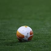 A Europa League football lies on the field before the UEFA Europa League 1st round day 2 Group D football match between Rangers FC and Lech Poznan at the Ibrox Stadium in Glasgow on October 29, 2020. (Photo by RUSSELL CHEYNE / POOL / AFP) (Photo by RUSSELL CHEYNE/POOL/AFP via Getty Images)