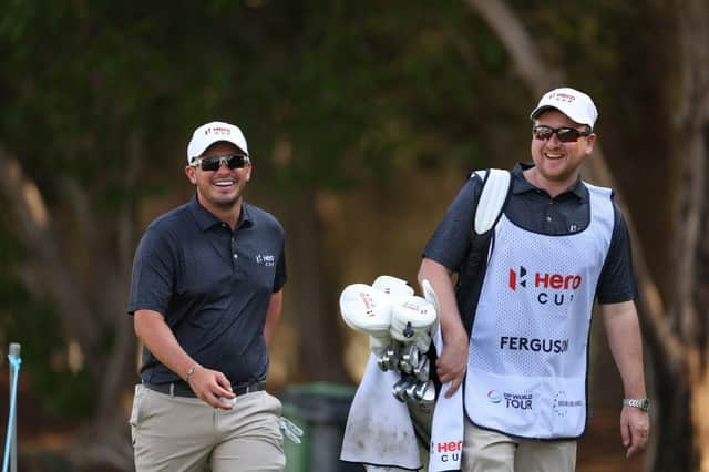 Ewen Ferguson has a laugh with his caddie, fellow Scot Stephen Neilson, during the pro-am ahead of the Hero Cup at Abu Dhabi Golf Club. Picture: Andrew Redington/Getty Images.