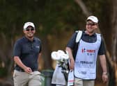 Ewen Ferguson has a laugh with his caddie, fellow Scot Stephen Neilson, during the pro-am ahead of the Hero Cup at Abu Dhabi Golf Club. Picture: Andrew Redington/Getty Images.