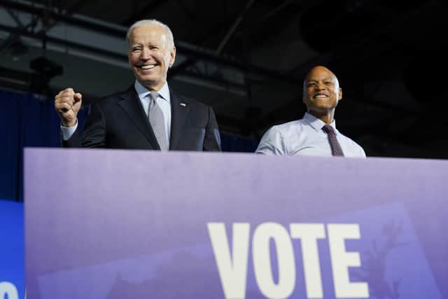 President Joe Biden stands on stage with Maryland Democratic gubernatorial candidate Wes Moore during a campaign event for Moore and others at Bowie State University in Bowie, Md., Monday, Nov. 7, 2022. (AP Photo/Susan Walsh)