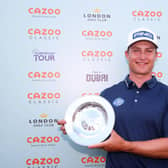 Calum Hill shows off the Cazoo Classic trophy after his win at the London Golf Club last August. Picture: Andrew Redington/Getty Images.