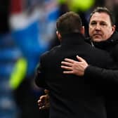 Ross County manager Malky Mackay embraces Rangers counterpart Michael Beale after the 2-1 defeat at Ibrox. (Photo by Rob Casey / SNS Group)