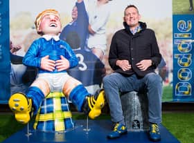Doddie Weir with the Oor Doddie statue  at BT Murrayfield, in 2019.
