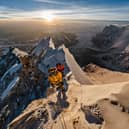 As the sun rises above the Tibetan Plateau, Pasang Kaji Sherpa (front) and Lhakpa Tenje Sherpa pass 28,700 feet on Mount Everest. The big question: Did George Mallory and Sandy Irvine get this far — or perhaps reach the top — in 1924? (PIC: Renan Ozturk/National Geographic)