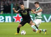 Celtic's Matt O'Riley challenges Eden Hazard of Real Madrid during the Champions League match at Parkhead on Tuesday. (Photo by Alan Harvey / SNS Group)