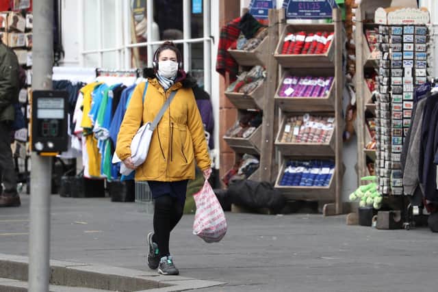 A woman wearing a face mask in Edinburgh.