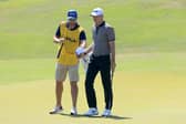 Martin Laird is handed his ball by fellow Sco Kevin McAlpine as he prepares to putt on the 17th hole during the second round of the 2021 PGA Championship at Kiawah Island. Picture: Sam Greenwood/Getty Images.