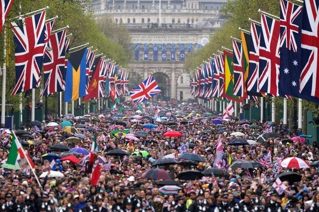 Scenes on the Mall as members of the public wait to greet the Royals