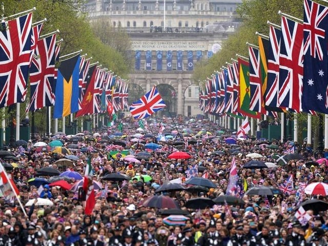 Scenes on the Mall as members of the public wait to greet the Royals