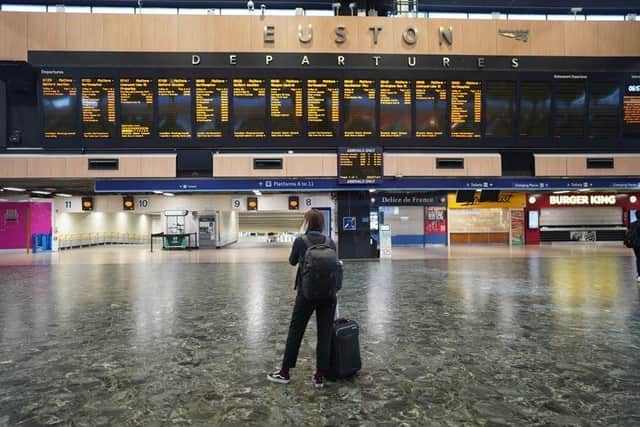 Passengers at Euston station in London, as members of the Rail, Maritime and Transport union begin their nationwide strike